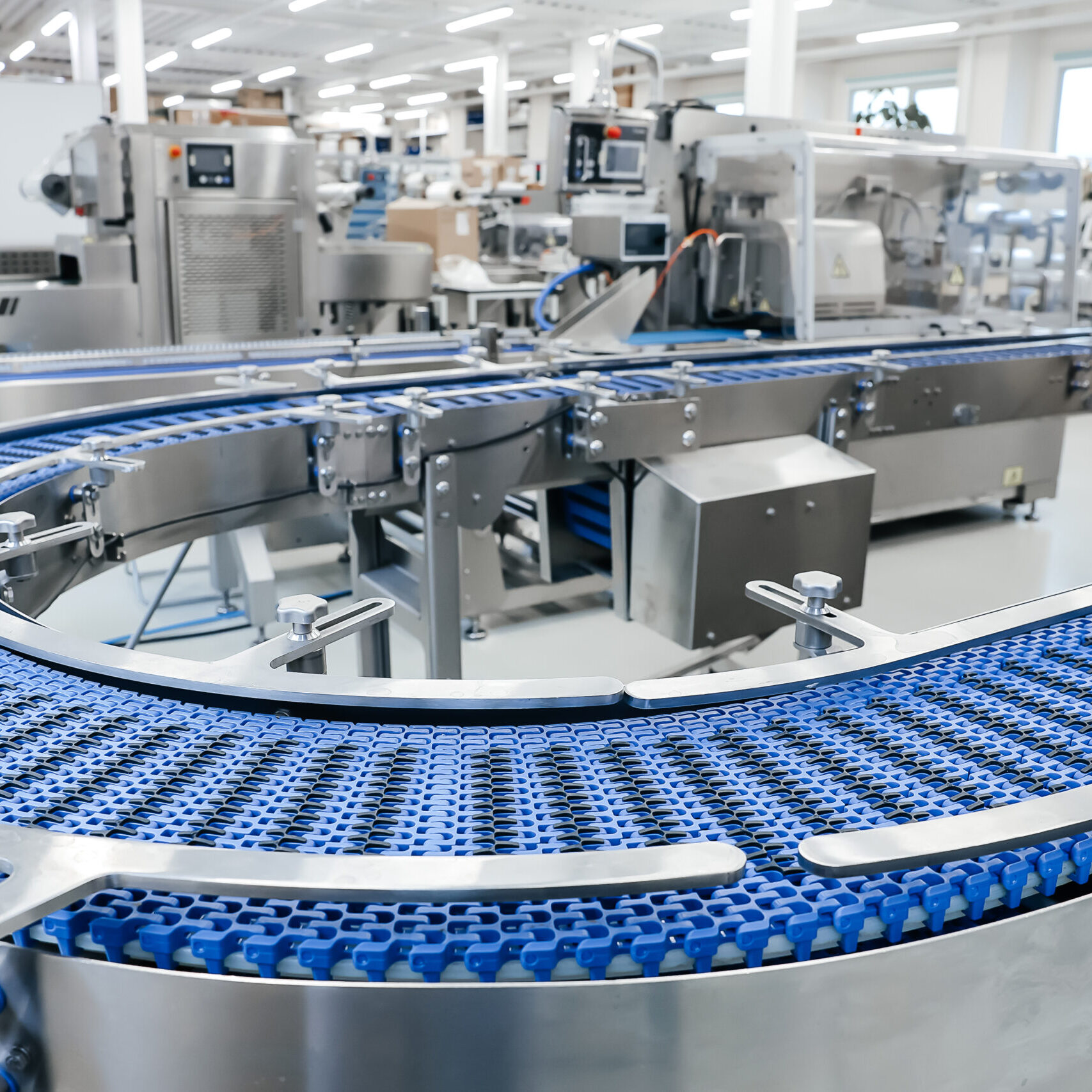 Empty modern conveyor belt of production line, part of industrial equipment in factory plant. Automatic system line Empty modern conveyor belt of production line, part of industrial equipment in factory plant. Automatic system line